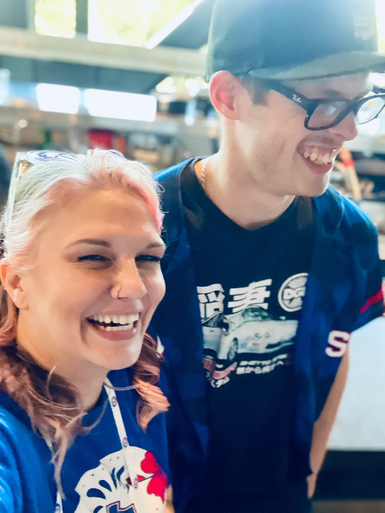 A man and woman smiling for the camera.