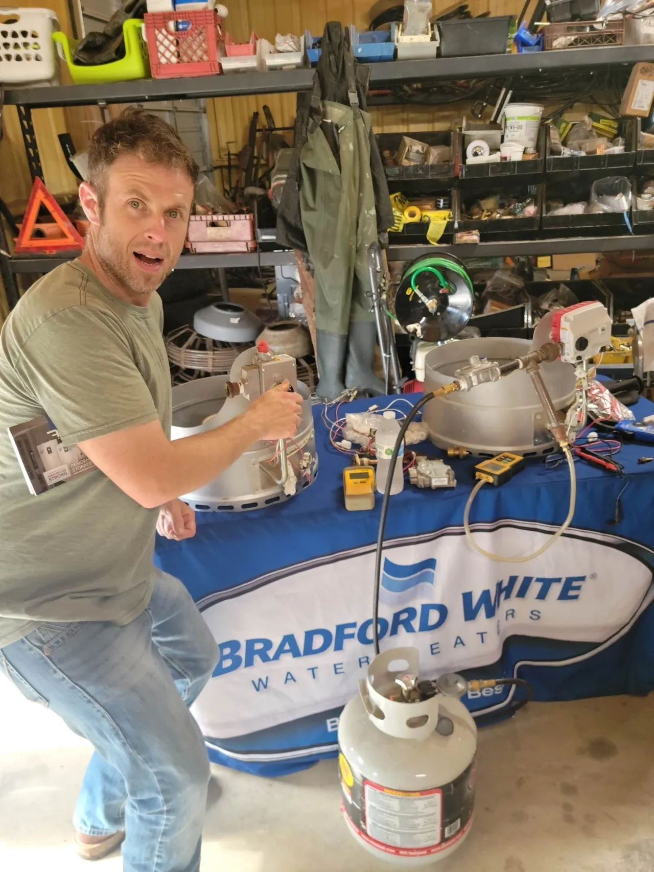 A man standing in front of a table with a mixer.